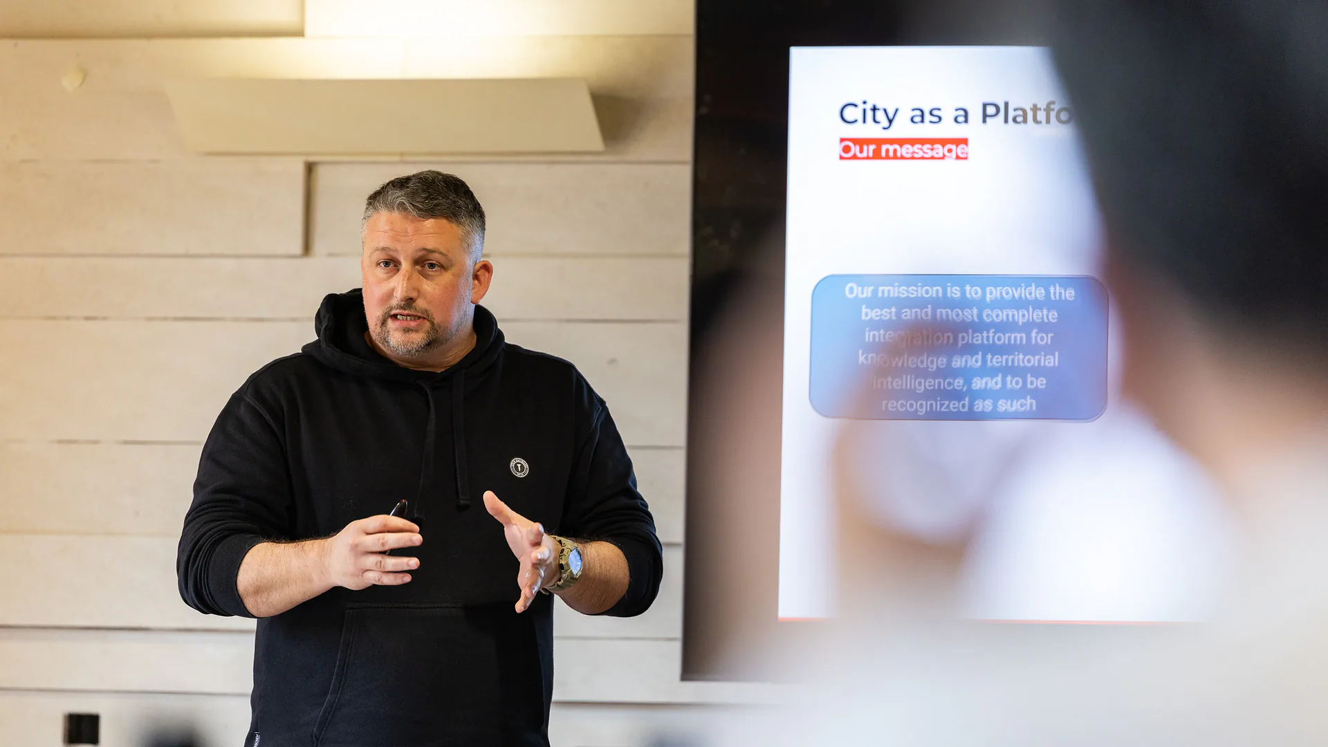 Scenic outdoor landscape with a green lawn, small pond with reeds, and trees under a partly cloudy sky.
